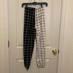 Half-and-half, black, and white casual pants